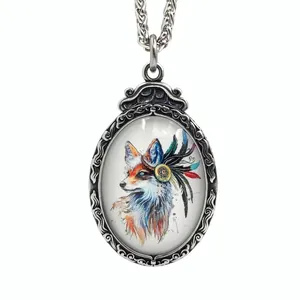 Macro detail of oval pendant featuring colorful native-style painting on silver metal