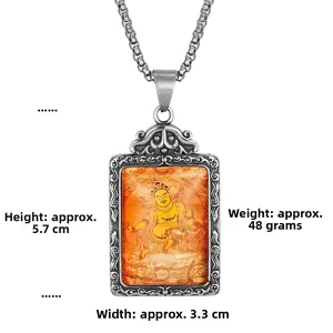 Detailed view of Mahakala titanium steel pendant with dimensions 5.7cm by 3.3cm
