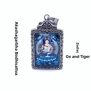 Detail of Akasagarbha Bodhisattva pendant with relief metal frame for Zodiac Ox and Tiger