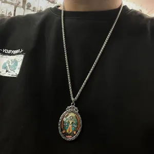 Retro titanium steel necklace with an oval painted Thangka pendant and wheat chain