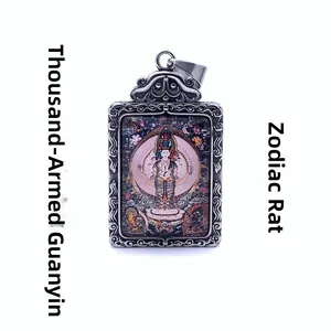 Macro detail of silver titanium steel pendant with Thousand-hand Guanyin art and zodiac rat