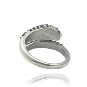 Punk style snake-inspired stainless steel ring with black stones and metallic finish