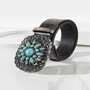 Vintage leather belt featuring oversized silver buckle with turquoise and crystal inlay