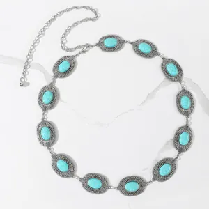 Bohemian silver concho belt featuring engraved metal motifs and turquoise stones