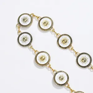 Bohemian gold sun chain belt with white enamel medallion pendants and sunburst face charms