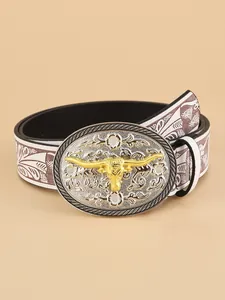 Detail of western belt featuring a golden bull head buckle with floral embossed patterns