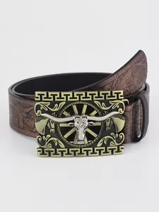 Detail of vintage western belt buckle with longhorn bull engraving and scroll patterns
