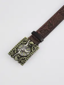 Detailed view of western leather belt with embossed bull head bronze buckle