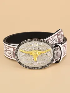 Detailed view of western belt featuring golden bull head on engraved oval buckle