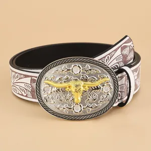 Vintage western belt with white embossed leather and a large golden bull head buckle