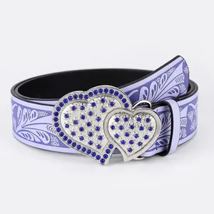 Detail of lavender PU leather belt with floral pattern and blue rhinestone heart buckle