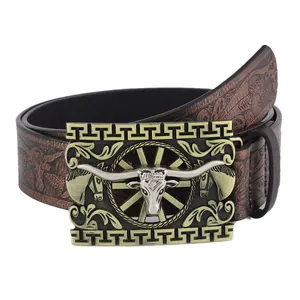 Western cowboy belt featuring a large bull head engraved buckle and embossed leather strap