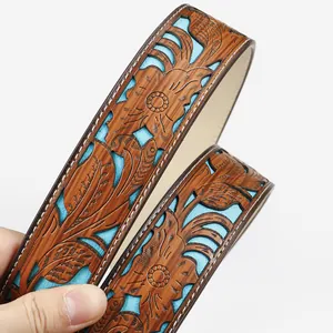 Western vintage carved leather belt with turquoise lining and floral embossed patterns