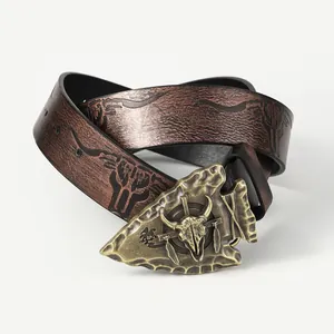 Western style dark brown leather belt featuring a bronze bull skull buckle and embossed strap