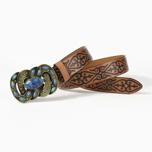 Bohemian brown leather belt with vintage bronze buckle and turquoise stones on white background
