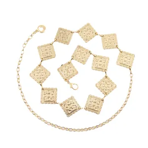 Elegant gold metal waist chain with square embossed pattern panels and adjustable clasp