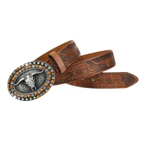 Vintage western leather belt featuring embossed bull head and silver cowboy buckle