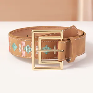 Vintage embroidery belt with geometric patterns and large gold metal buckle