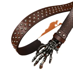 Gothic brown leather belt featuring silver rivets and a detailed metal skull hand buckle