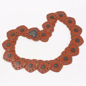 Vintage western cowboy brown leather belt with heart-shaped metal buckles and studs
