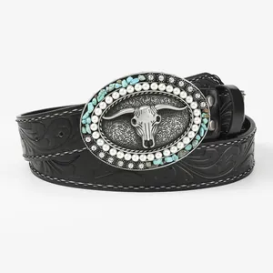 Vintage western cowboy leather belt with turquoise cow skull buckle and floral embossing