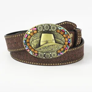 Vintage western leather belt with floral embossing and bronze cowboy buckle on white back