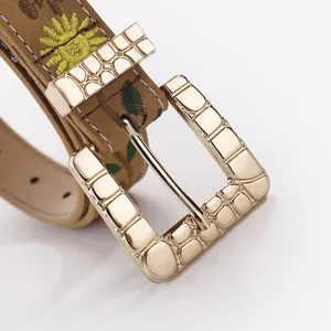 Vintage brown leather belt with floral embroidery and gold embossed buckle