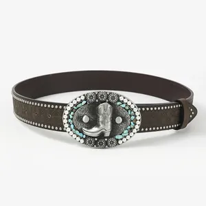 Close-up of vintage brown leather belt with embossed floral patterns and turquoise buckle