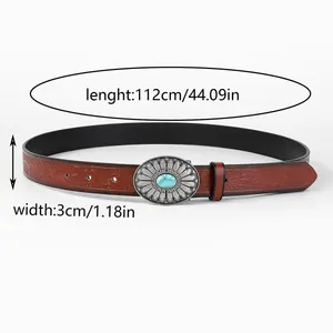 Detail of vintage floral embossed leather belt with turquoise buckle 112cm x 3cm
