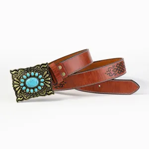 Detail of western cowboy leather belt with vintage floral buckle and turquoise stones