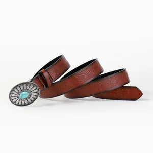 Vintage western leather belt with embossed bull motifs and a turquoise buckle