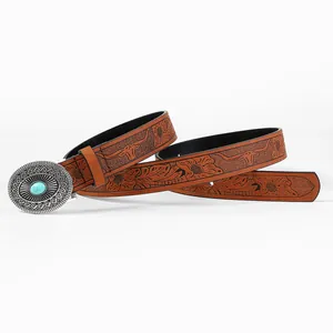 Close-up of bohemian leather belt with bull head embossing and turquoise buckle