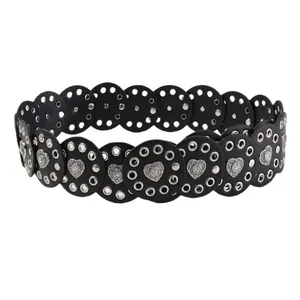 Western style black leather belt with circular cutouts and silver heart metal accents