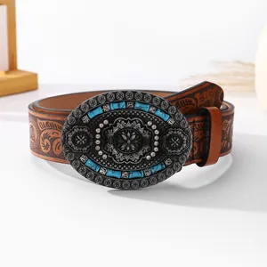 Vintage brown leather belt with embossed patterns and turquoise floral metal buckle