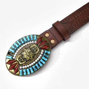Retro western brown leather belt with embossed patterns and large engraved floral buckle