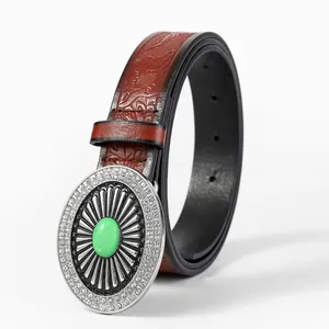Vintage western leather belt with embossed eagle patterns and green stone buckle