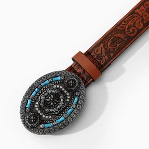 Close-up of vintage brown leather belt featuring embossed floral buckle and turquoise inlay