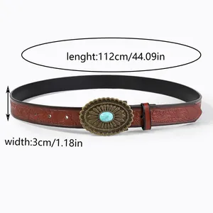 Detail of vintage embossed brown leather belt with 112cm length and turquoise buckle