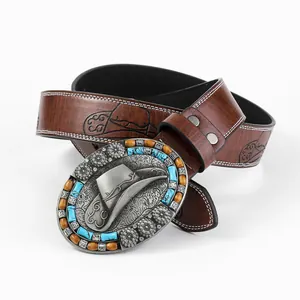 Detalle de hebilla vaquera con relieve de sombrero de cowboy e incrustación turquesa