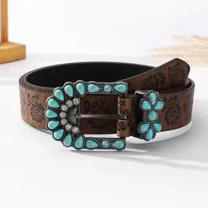 Bohemian vintage brown leather belt featuring turquoise buckle and floral embossing