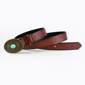 Vintage western brown leather belt with embossed floral pattern and turquoise metal buckle