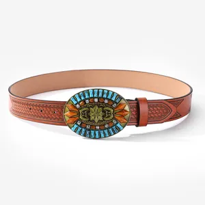 Detail of western cowboy brown leather belt with embossed patterns and large vintage buckle