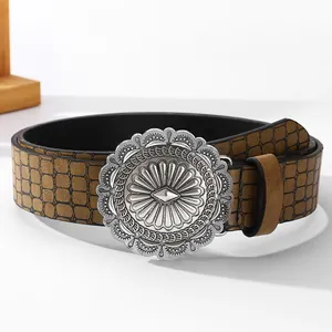 Vintage brown leather belt with crocodile texture and engraved sunburst concho buckle