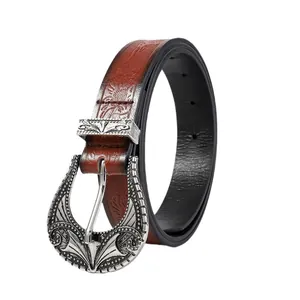 Western vintage embossed leather belt with ornate silver buckle on white background