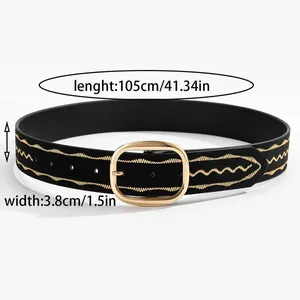 Detail of 3.8cm wide black belt with golden wave embroidery and oval metal buckle