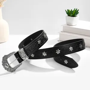 Punk black leather belt with star rivets and vintage silver floral buckle on white surface