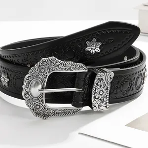 Punk style black leather belt featuring star rivets and embossed western floral metal buckle