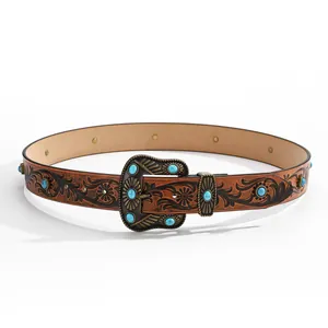 Vintage western leather belt with floral embossing and turquoise stones in a circular layout