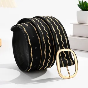 Women's black belt with golden wave embroidery and large oval metal buckle