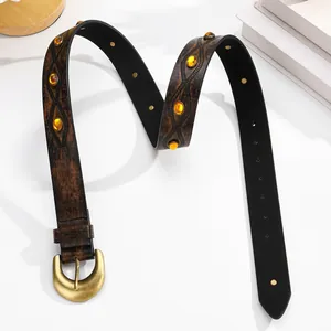 Vintage western cowboy belt with brown leather texture, amber beads, and metal buckle